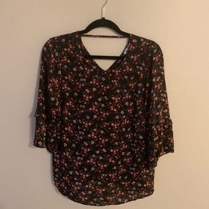3/4 length floral top with bell sleeves.